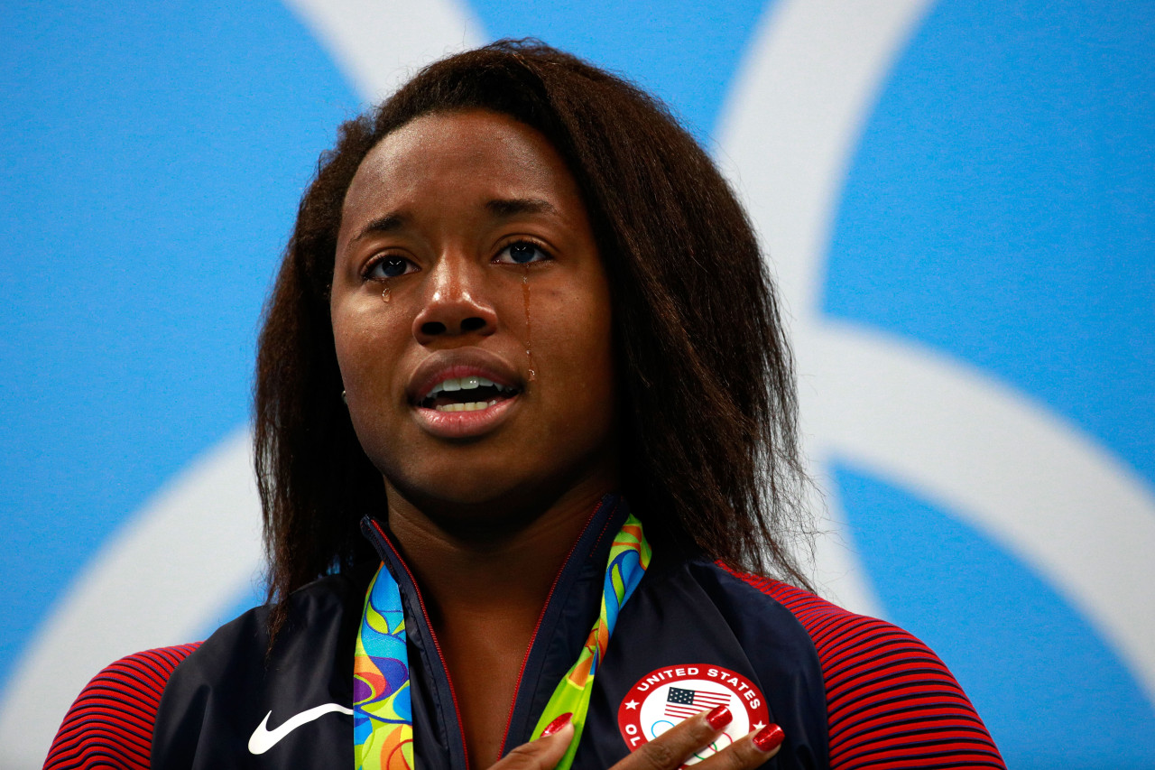1st African-American female swimmer to take gold dedicates victory to ending police brutality